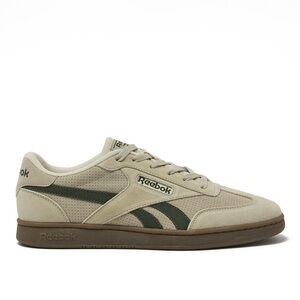 Tan and green Reebok sneakers